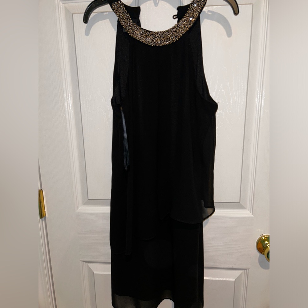Black ruffled layer halter neck with gold neckline dress. Perfect for going out